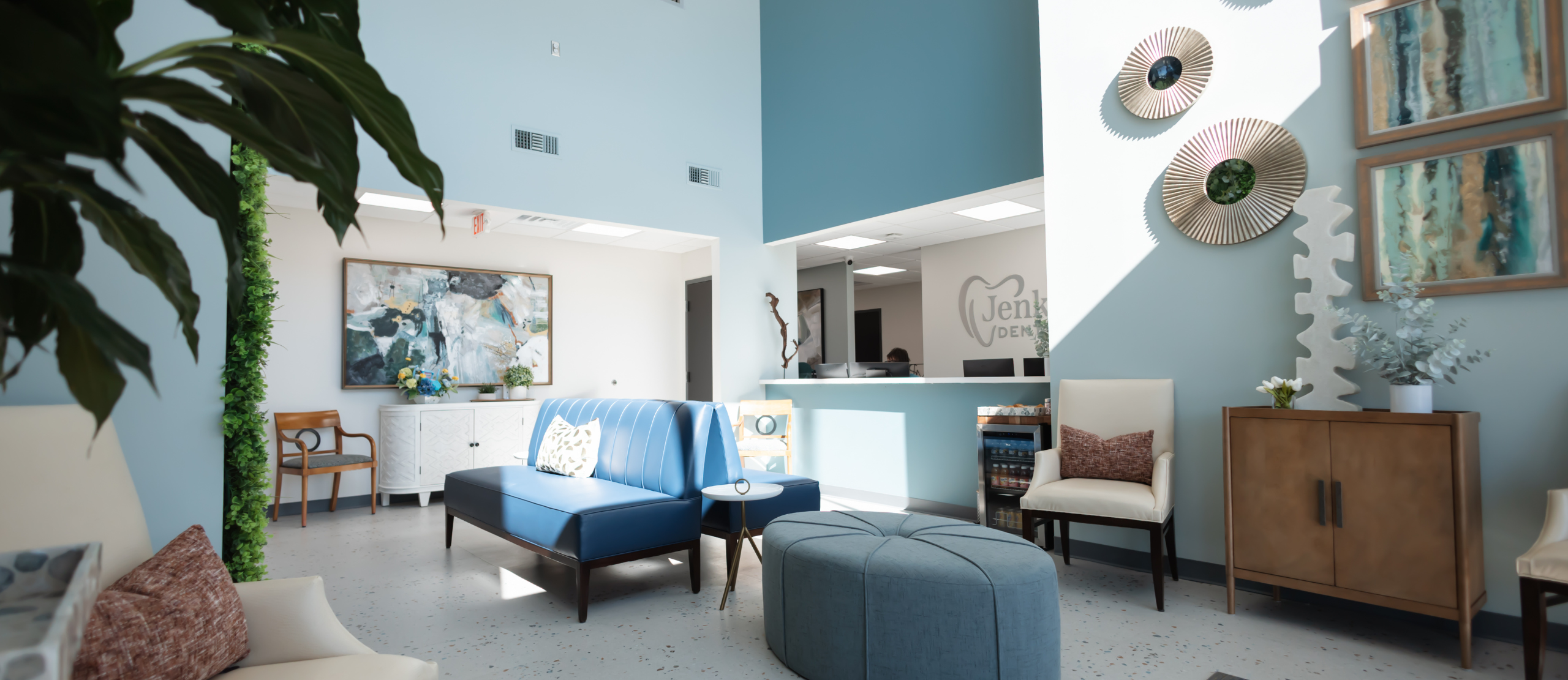 A modern office featuring blue walls and matching blue furniture, creating a cohesive and stylish workspace.